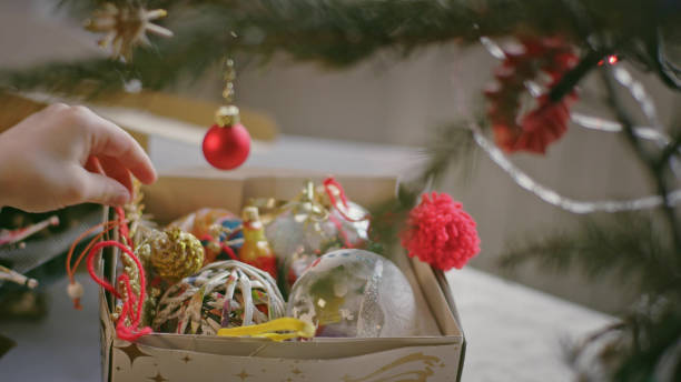 istock Teenage boy undressing Christmas tree 1137583417