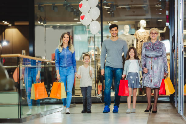 istock Family shopping for clothes and looking happy 1137584577