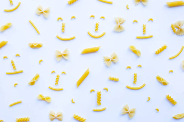 istock Different types of dry pasta on white. 1137585133