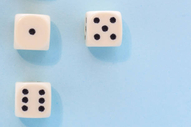 istock White gaming dices on light blue background. victory chance, lucky. Flat lay, place for text. Top view. Close-up. Concept gamble. spectacular pastel 1137585365