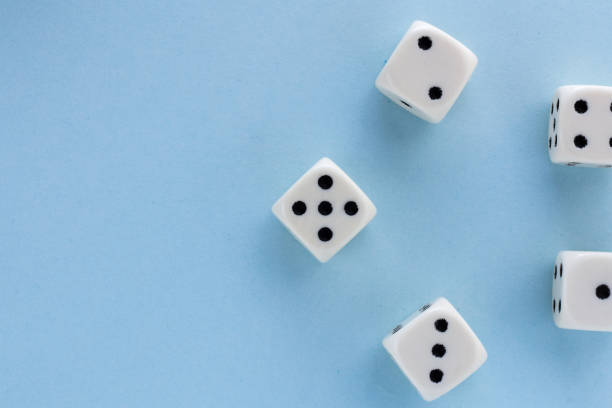 istock White gaming dices on light blue background. victory chance, lucky. Flat lay, place for text. Top view. Close-up. Concept gamble. spectacular pastel 1137585518