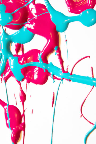 istock Pink and Blue Messy Paint Splatters On White Background 1137587960