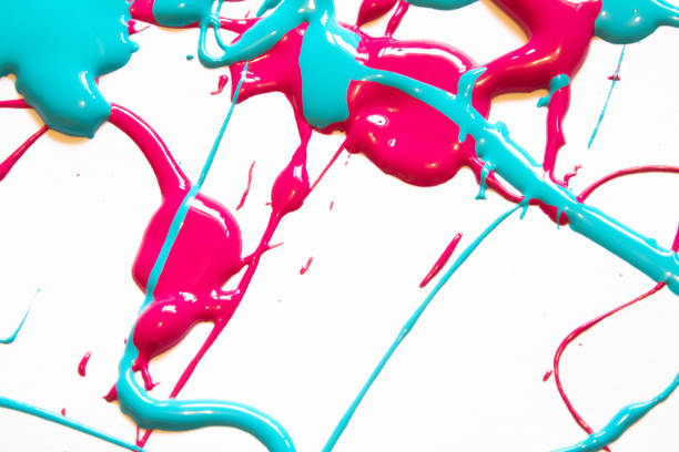 istock Pink and Blue Messy Paint Splatters On White Background 1137588765