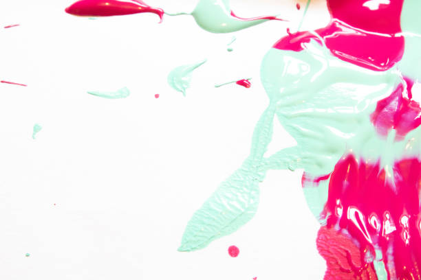 istock Pink and Blue Messy Paint Splatters On White Background 1137589013