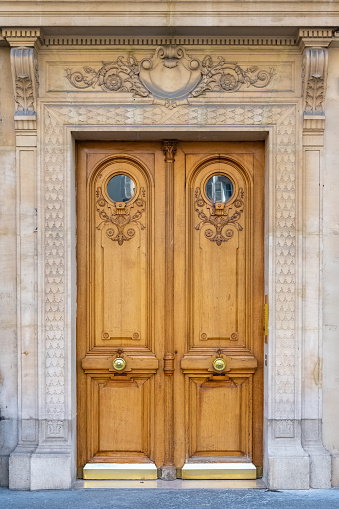 Paris, beautiful wooden massive door, girder with sculptures