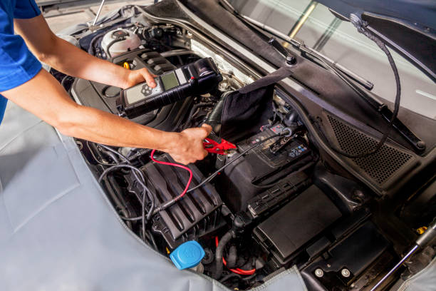 istock Car repair battery 1137591272