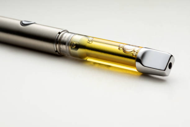 High THC Potency Cannabis Oil Vape Pen High THC Potency Cannabis Oil Vape Pen Isolated on a White Background thc photos stock pictures, royalty-free photos & images