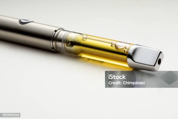 High Thc Potency Cannabis Oil Vape Pen Stock Photo - Download Image Now - Electronic Cigarette, Pen, Cannabis Plant