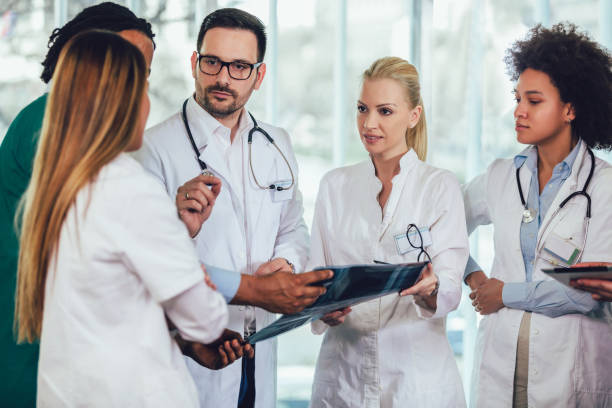 istock Group of medics discuss x-ray scan 1137594784