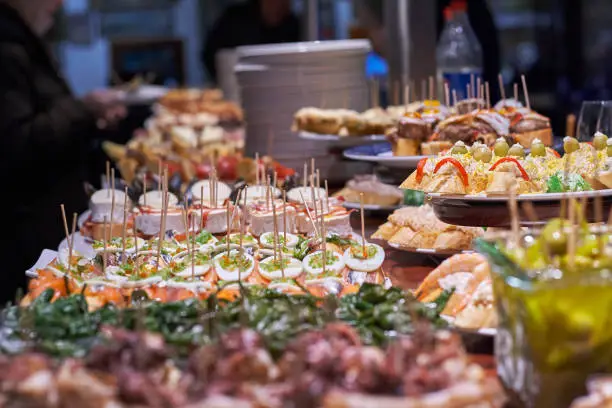 Pinchos and tapas typical of the Basque Country, Spain. Selection of different types of foods to choose from. San Sebastian.