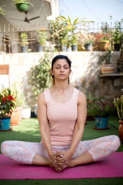 istock One women meditating outdoors 1137596020