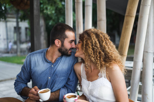 istock Young couple in cafeteria flirting while drinking coffee 1137596646