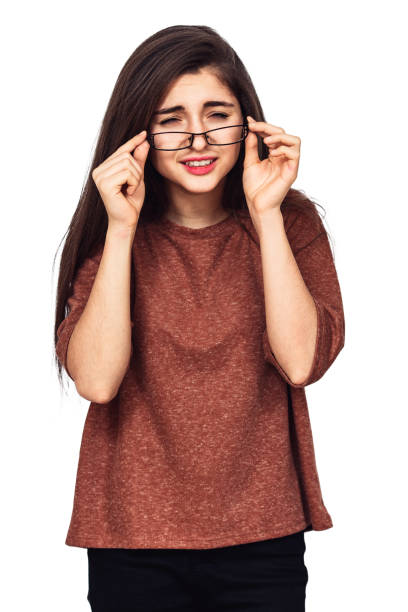 istock A young girl sees very badly without glasses. 1137599894
