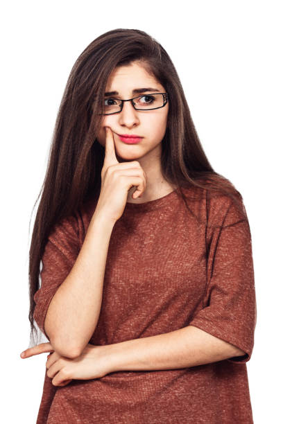 istock A young pretty girl with glasses thought about something. 1137599906