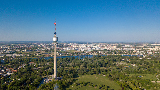 Beautiful drone shot of Viennas Donauturm with a blue sky daytime