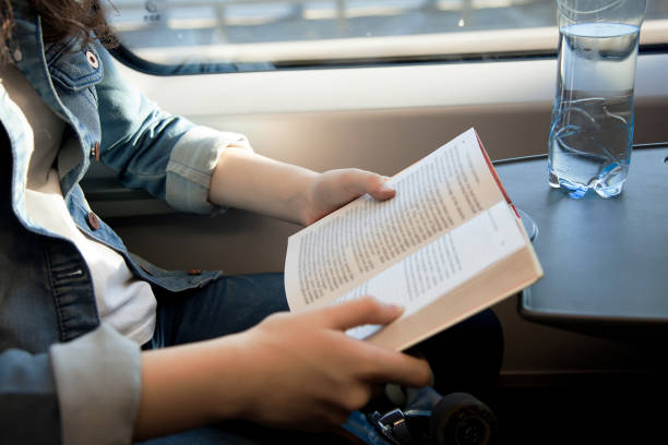 istock reading traveler a book in a train 1137601066