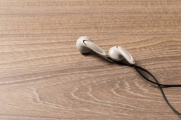 istock headphones and on rustic wooden table. Top view 1137601747