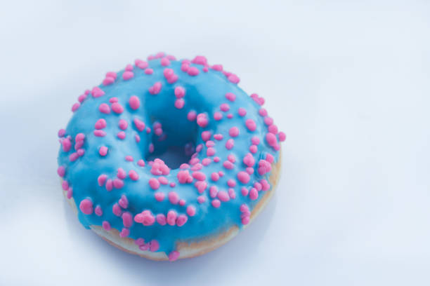 istock sweet Donut with icing and color dusting, on a white background 1137603218