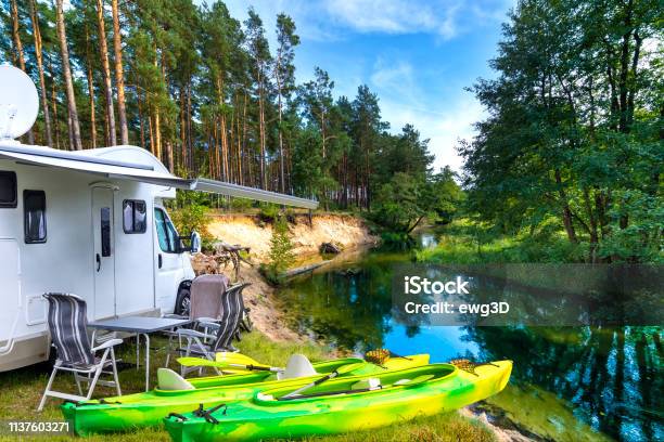 Summer Vacation With A Camper By The River Stock Photo - Download Image Now - Motor Home, Camper Trailer, River