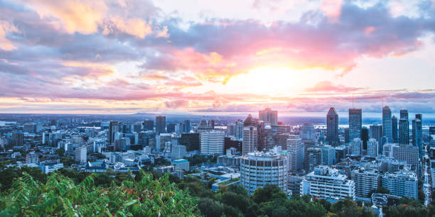 Beautiful sky and sunrise light over Montreal city in the morning time. Amazing view from Mont-Royal with colorful blue architecture. stock photo