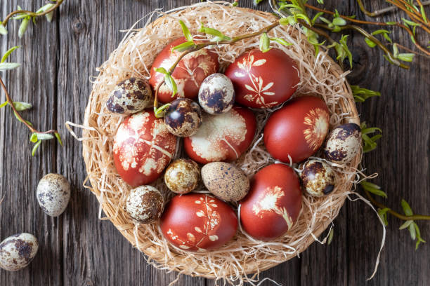 istock Quail and Easter eggs dyed with onion peels in a wicker basket 1137605276