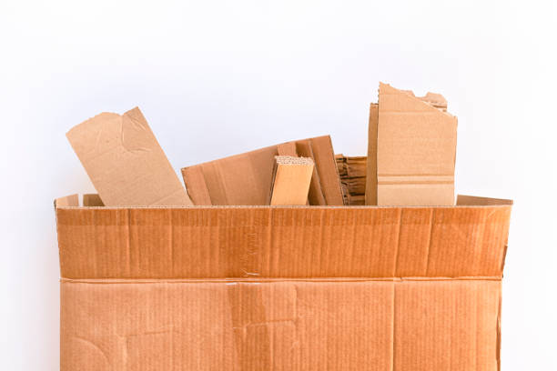 istock Cardboard box with cardboard pieces against white background. 1137605764
