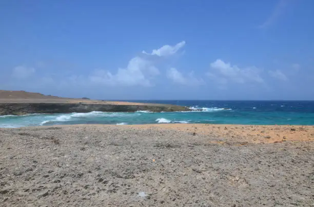 Daimari beach with waves rolling ashore in Aruba.