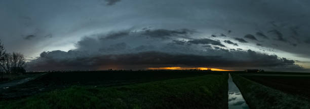 istock Panorama of a thunderstorm over the dutch landscape after sunset. 1137610205