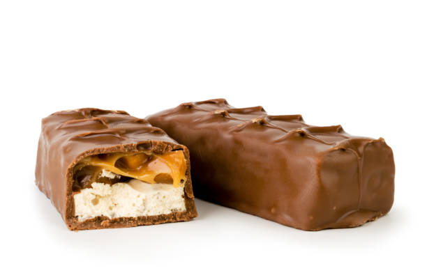 istock Chocolate Snickers and half close - up on a white. Isolated 1137614195