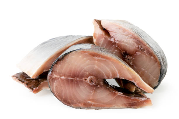 istock Fresh pieces of herring close up on a white. Isolated. 1137615213