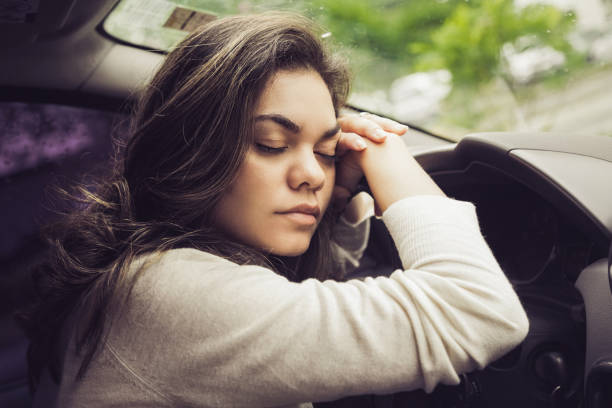 Woman exhausted after a full day of work Car, Driving, Businesswoman, Land Vehicle, Brazil narcolepsy stock pictures, royalty-free photos & images