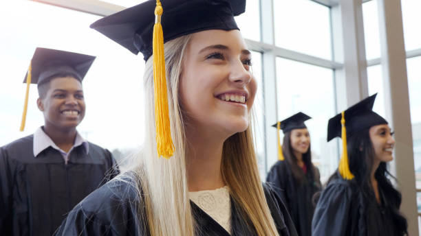 istock Young woman enjoys graduation ceremony 1137620134