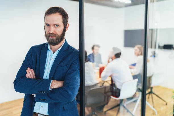 istock Businessman with his team behind 1137620224