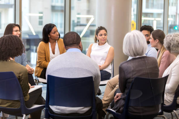 istock Business people listen to colleague during meeting 1137620249