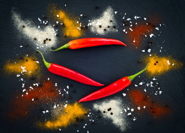 istock Salt and pepper seasoning on dark background 1137621272