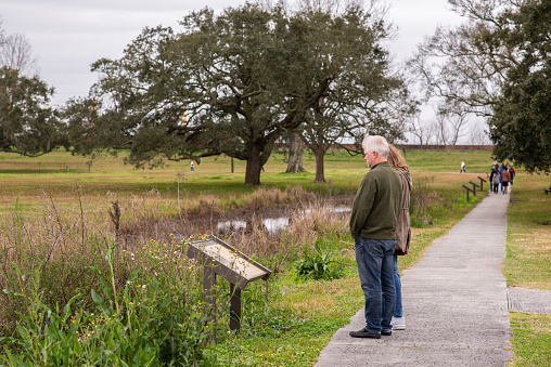 New Orleans, Louisiana / USA - February 15, 2019: People exploring the historic Chalmette Battlefield, site of the Battle of New Orleans in the War of 1812. The site is now a beautiful, peaceful park.