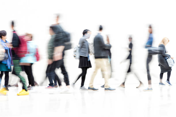 istock Blurred Businesspeople Walking on White Hallway, Motion Effect 1137623102