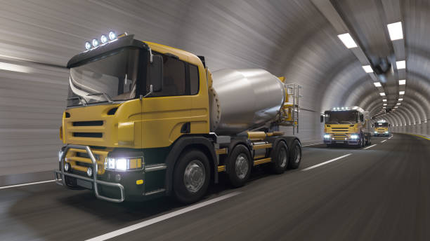 cement trucks moving in a row inside the tunnel - truck motion road cement truck imagens e fotografias de stock