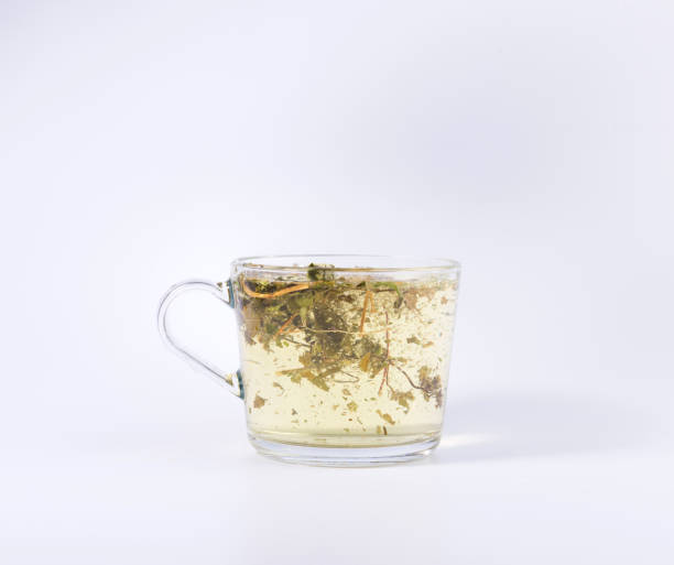 istock green herbal tea in a transparent cup isolated on white background 1137626339