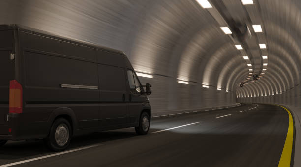 Black Van Going Through an Empty Tunnel stock photo