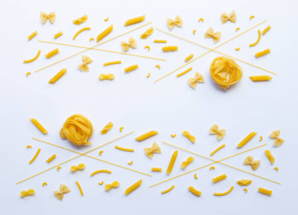 istock Different types of dry pasta on white. 1137629319