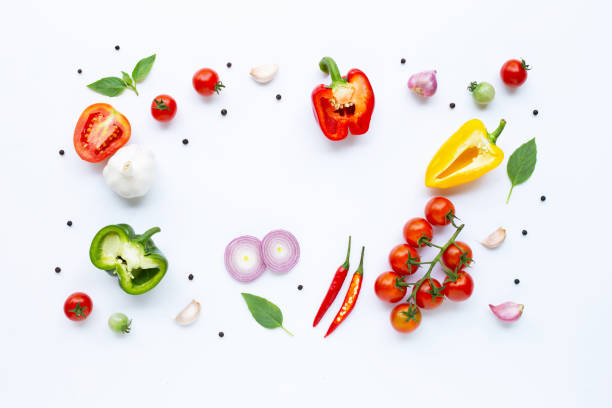 istock Various fresh vegetables and herbs on white background. Healthy eating concept 1137629490