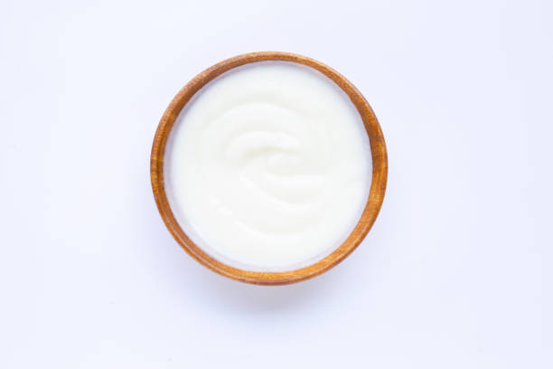 istock White yogurt in wooden bowl on white 1137631537