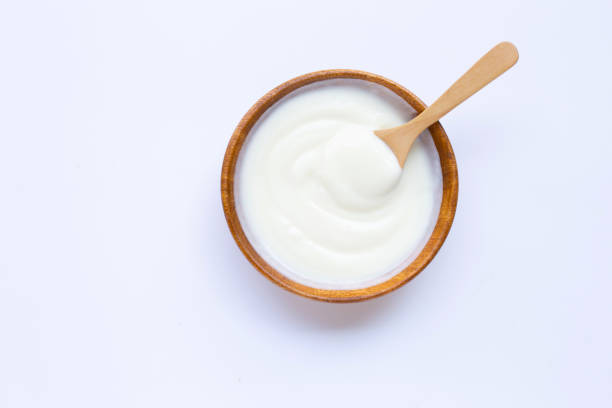 istock White yogurt in wooden bowl on white 1137631555