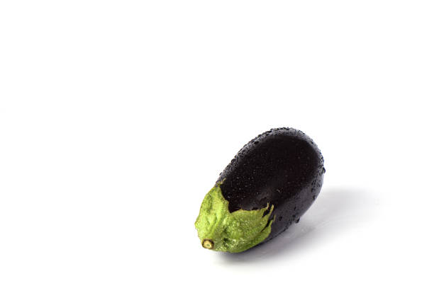 istock Eggplant or aubergine with water drops isolated on white background. 1137632636