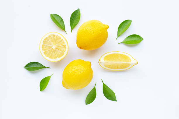 istock Lemon and slices with leaves isolated on white. 1137632704