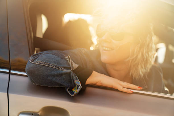 istock Two Young Women Driving Car and Having Fun 1137634842