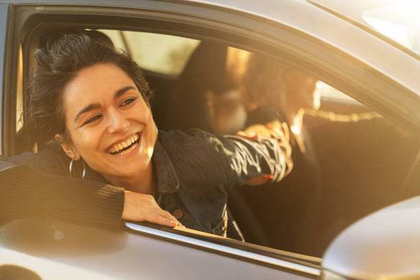 istock Two Young Women Driving Car and Having Fun 1137635398