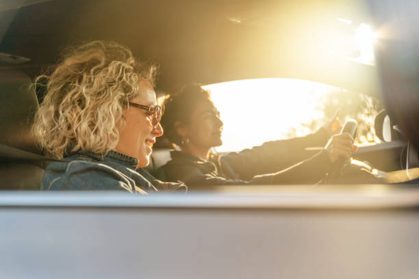 istock Two Young Women Driving Car and Having Fun 1137635399