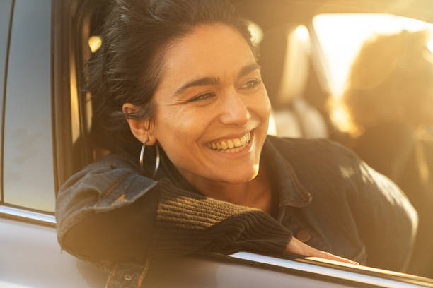 istock Two Young Women Driving Car and Having Fun 1137635513